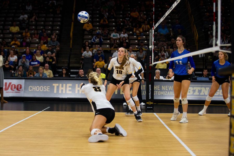 Reghan Coyle dives for the ball during Iowas match against Eastern Illinois on Sunday, September 9, 2018 at Carver-Hawkeye Arena. The Hawkeyes won the match 3-0.