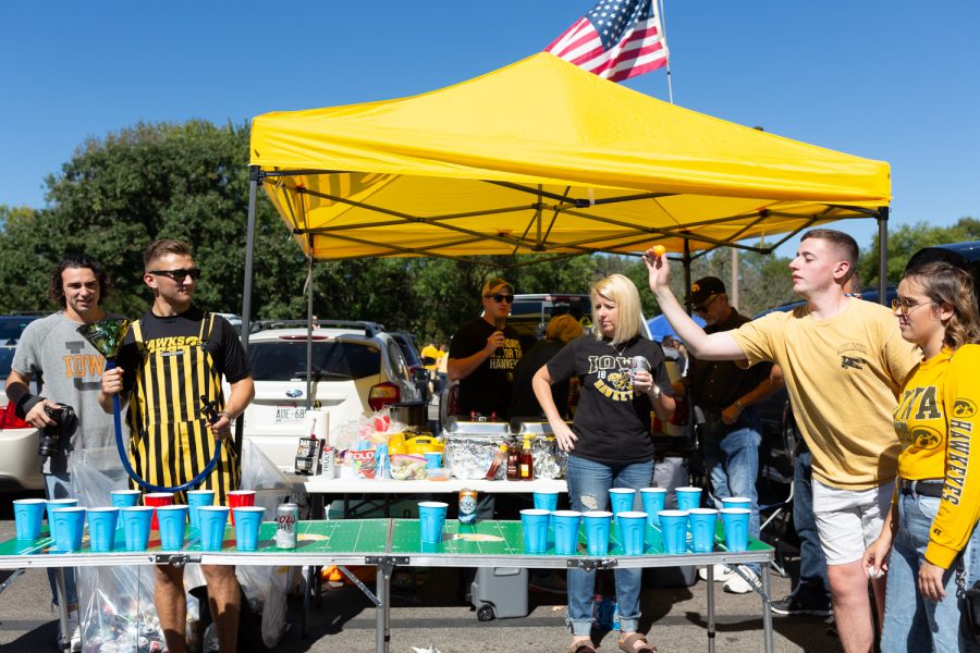 Tailgaters play drinking games in the Myrtle Ave. lot before the Iowa-Wisconsin football game on Saturday, Sep. 22, 2018. (David Harmantas/The Daily Iowan)