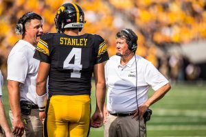 Iowa quarterback Nate Stanley talks with offensive coordinator Brian Ferentz during Iowas game against Northern Illinois at Kinnick Stadium on Saturday, Sept. 1, 2018. The Hawkeyes defeated the Huskies 33-7.