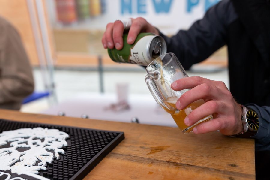 A vendor pours a beer at the Northside Oktoberfest in Iowa City on Saturday, Sep. 29, 2018. 