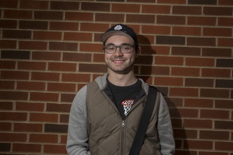 Sophomore Tyler Radcliffe poses for a portrait outside the Adler Journalism Building on Tuesday, Sept. 25, 2018. Radcliffe hopes to go into screenwriting or producing and can be found working on his Youtube channel or designing commissioned pieces. 