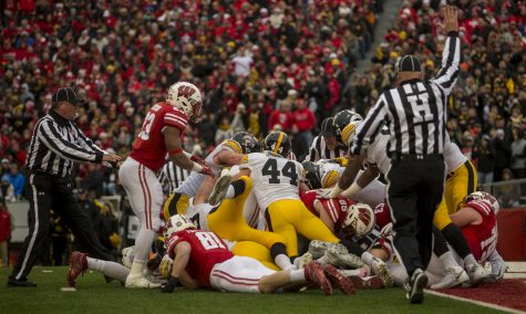 Referees attempt to spot the football during Iowas game against Wisconsin at Camp Randall Stadium on Saturday, Nov. 11, 2017. The badgers defeated the Hawkeyes 38-14. 
