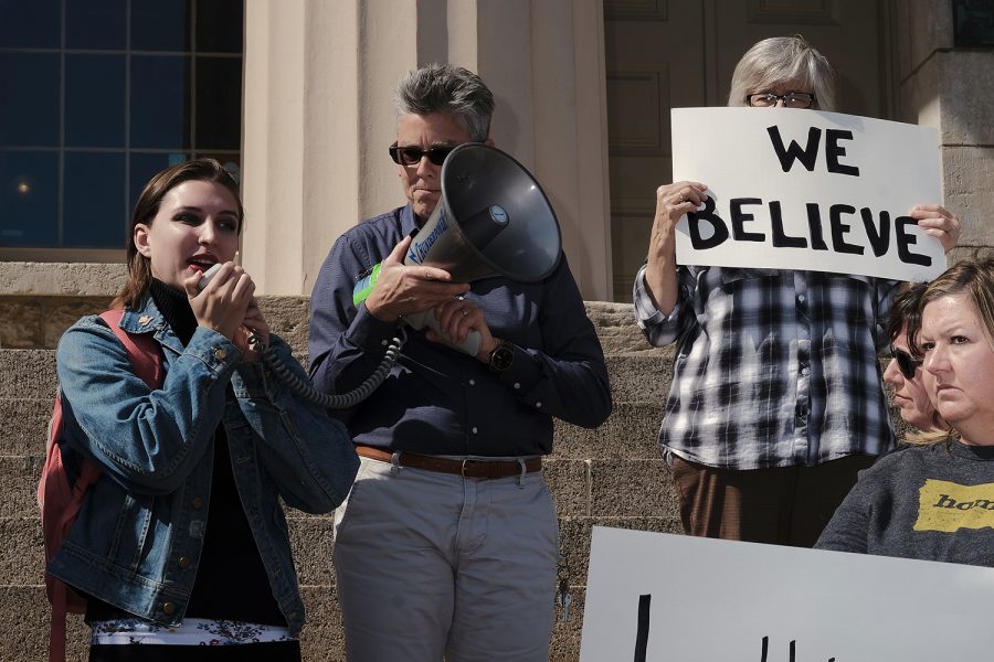 Community members gather on the steps of the Old Capitol in Iowa City on Thursday, Sept. 27, 2018 to protest the nomination of Judge Brett Kavanaugh to the Supreme Court. Protesters spoke in support of victims of sexual violence and shared personal stories about coming forward as victims of sexual violence.
