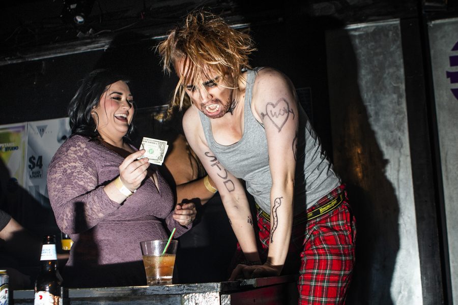 I.C. Kings performer Abel Justice receives tips from the audience during I.C. Kings present Netflix and Chill at Studio 13 on Thursday, August 30, 2018. The drag king troupe produced a number of dances and videos to help bring Netflix to life for the audience. 