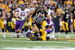 Iowa Hawkeyes wide receiver Nick Easley (84) is taken to the turf as the ball bounces away during a game against Northern Iowa at Kinnick Stadium on Saturday, Sept. 15, 2018. The Hawkeyes defeated the Panthers 38–14. 