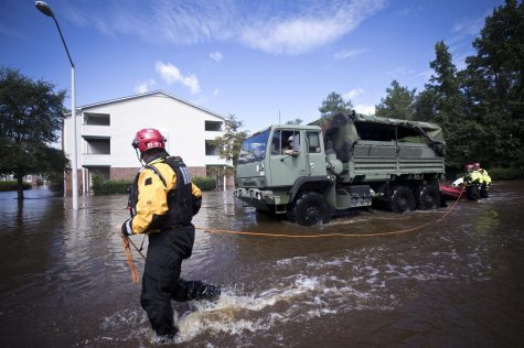New York Urban Search and Rescue team members, along with members of the N.C. Army National Guard, prepare to evacuate residents at the Heritage at Fort Bragg Apartments in Spring Lake, N.C., Tuesday Sept. 18, 2018. (Julia Wall/Raleigh News & Observer/TNS)