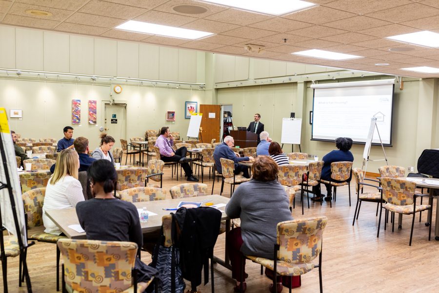 Participants in a meeting about issues regarding fair housing in Iowa City listen to Kirk Lehman present on the issue at the Iowa City Senior Center on Thursday, Sept. 27, 2018. 