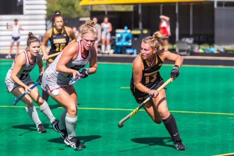Iowa forward Leah Zellner fights for control of the ball during a field hockey match against Penn on Friday, Sept. 14, 2018. The Hawkeyes defeated the Quakers 3–0.