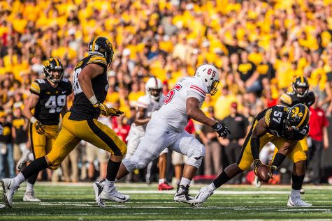 Iowas Chauncey Golston recovers a fumble during Iowas game against Northern Illinois at Kinnick Stadium on Saturday, Sept. 1, 2018. The Hawkeyes defeated the Huskies 33-7.