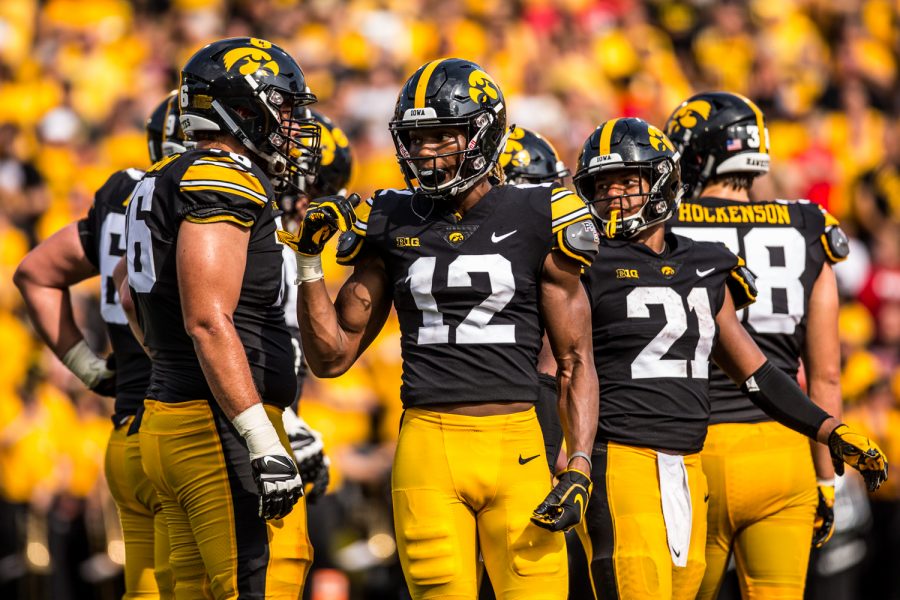 Iowa wide receiver Brandon Smith talks with teammates in the huddle during Iowas game against Northern Illinois at Kinnick Stadium on Saturday, September 1, 2018. during Iowas game against Northern Illinois at Kinnick Stadium on Saturday, September 1, 2018. The Hawkeyes defeated the Huskies 33-7.