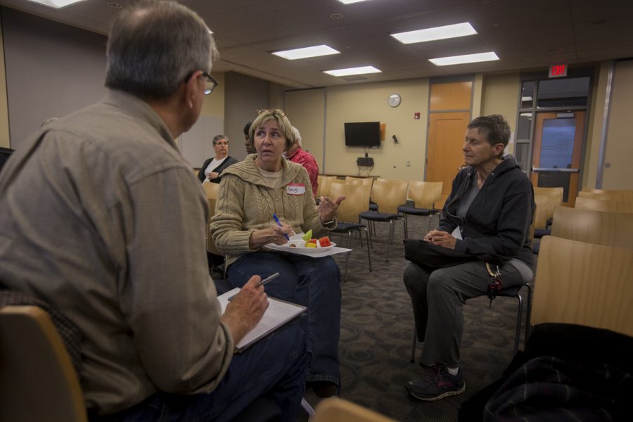 Attendees participate in a group activity during an Iowa City Human Rights Commission event in the Iowa City Public Library on Thursday, October 13, 2016. The event was broken up into two sections, the first focusing on how to engage individuals, and the second on survey result findings from the Iowa City school district.