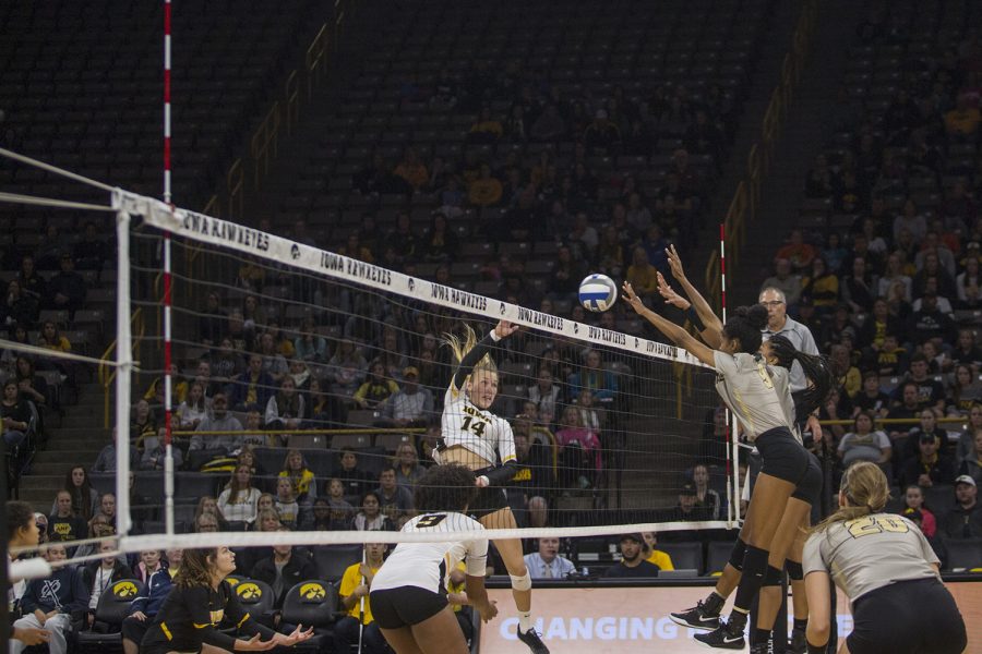 Junior Cali Hoye spikes the ball during Iowa volleyball against Purdue at Carver-Hawkeye Arena in Iowa City on Saturday, Oct. 13, 2018. Purdue defeated Iowa 3-2. (Katie Goodale/The Daily Iowan).