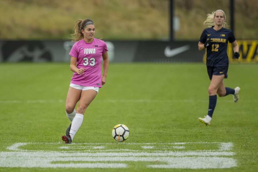 Iowa defender Riley Burns prepares to cross the ball during Iowa's game against Michigan at The Hawkeye Soccer Complex on Sunday, October 14, 2018. The Hawkeyes defeated the Wolverines 1-0.