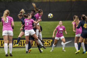 Players fight for a cross during Iowas game against Michigan at The Hawkeye Soccer Complex on Sunday, Oct. 14, 2018. The Hawkeyes defeated the Wolverines 1-0.