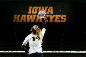 Junior Cali Home serves the ball during the Iowa Volleyball game against Northwestern at Carver-Hawkeye Arena in Iowa City on Wednesday, Oct. 25, 2018. Northwestern defeated Iowa 3-2. 