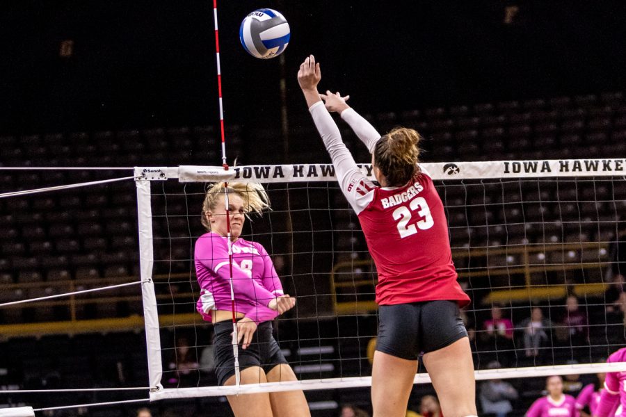 Iowa's Reghan Coyle follows through on the spike during a volleyball match against Wisconsin on Saturday, Oct. 6, 2018. The Hawkeyes defeated the number six ranked Badgers 3-2. 