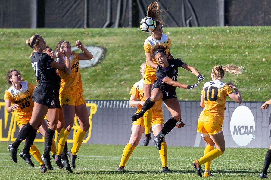 Iowa defender Hannah Drkulec heads the ball during Iowa's game against Northwestern on October 21, 2018. Iowa tied Northwestern 1-1. 