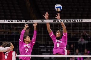 Iowas Brie Orr and Amiya Jones try to block the ball during a volleyball match against Wisconsin on Saturday, Oct. 6, 2018. The Hawkeyes defeated the number six ranked Badgers 3-2. 