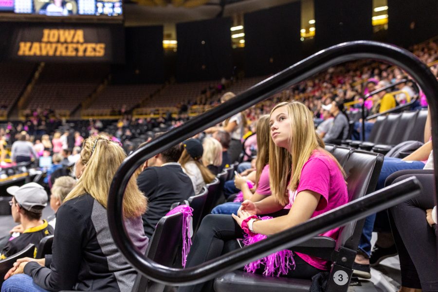 A young fan glances at the scoreboard during a volleyball match against Wisconsin on Saturday, Oct. 6, 2018. The Hawkeyes defeated the number six ranked Badgers 3-2. 