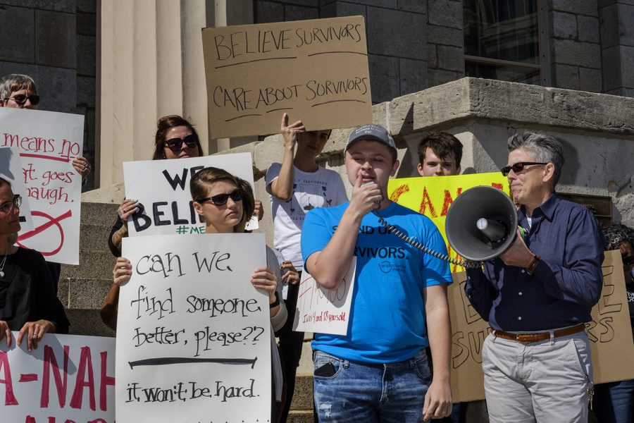 Community members gather on the steps of the Old Capitol in Iowa city on Thursday, Sept. 27, 2018 to protest the nomination of judge Brett Kavanaugh to the Supreme Court. Protestors spoke in support of victims of sexual violence and shared personal stories about coming forward as victims of sexual violence. 