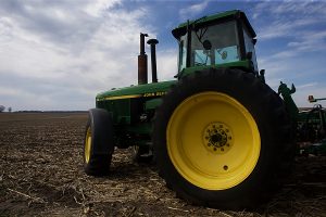 A tractor is parked in a field outside of Iowa City, Iowa on Wednesday, April 15, 2015.