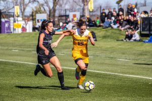 Iowa forward Rose Ripslinger dribbles the ball up the field during Iowas game against Northwestern on Oct. 21, 2018. Iowa tied Northwestern 1-1. 