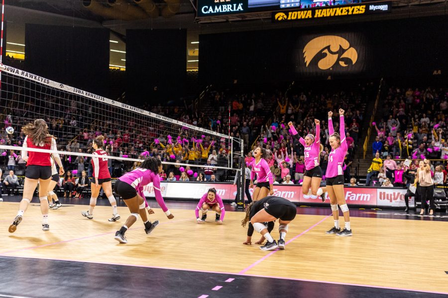 Iowa volleyball players celebrate winning the final match point against Wisconsin on Saturday, Oct. 6, 2018. The Hawkeyes defeated the number six ranked Badgers 3-2. 