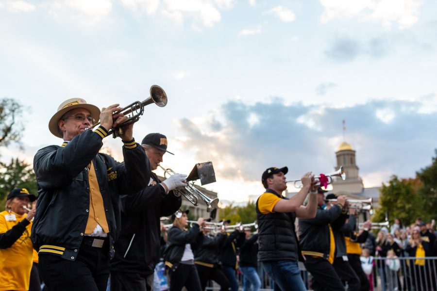 Members of the Hawkeyes Alumni Marching Band march in the Homecoming Parade on Friday, Oct. 19, 2018. 