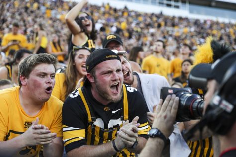 Fans cheer during the Iowa/UNI football game at Kinnick Stadium on Saturday, Sept. 15, 2018.