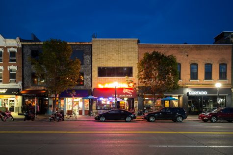In this composite photo, businesses line Clinton St. in Iowa City on a summer evening. Tuesday, Sept. 12, 2017. 