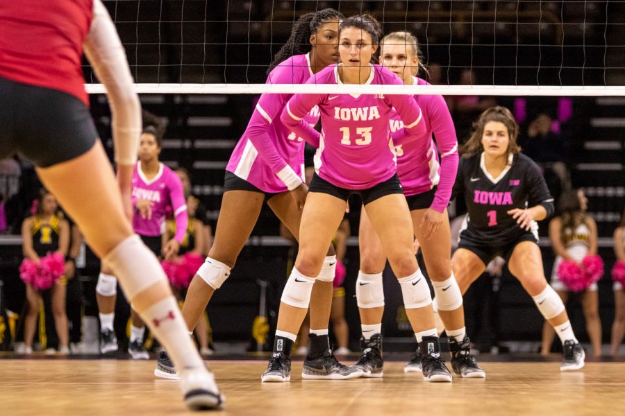 Iowa's Sarah Wing sizes up the opposing team during a volleyball match against Wisconsin on Saturday, Oct. 6, 2018. The Hawkeyes defeated the number six ranked Badgers 3-2. 