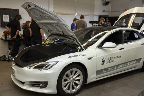 A Tesla automated driving research vehicle sits in a garage on display during an open house at the National Advanced Driving Simulator in Coralville on Wednesday Oct. 10, 2018. (Nick Rohlman/The Daily Iowan)