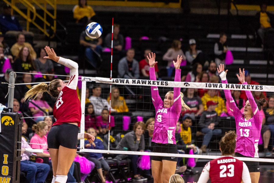 Iowa's Reghan Coyle and Sarah Wing prepare to defend the net during a volleyball match against Wisconsin on Saturday, Oct. 6, 2018. The Hawkeyes defeated the number six ranked Badgers 3-2. 