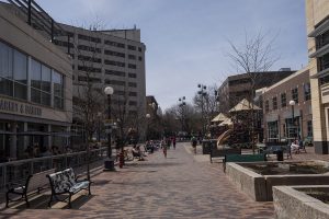 People walk in the Iowa City Pedestrian Mall on Thursday, April 26, 2018. Iowa City has released plans for renovations and updates to the area. 