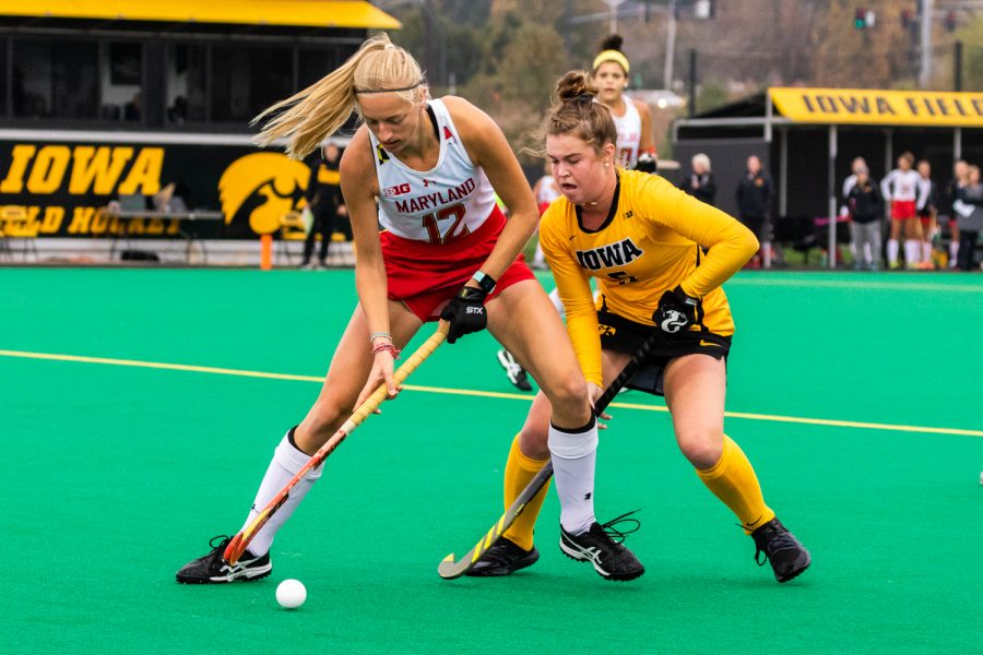 Iowa midfielder Meghan Conroy fights for the ball during a field hockey match against Maryland on Sunday, Oct. 14, 2018. The no. 2 ranked Terrapins defeated the no. 8 ranked Hawkeyes 2-1. (David Harmantas/The Daily Iowan)