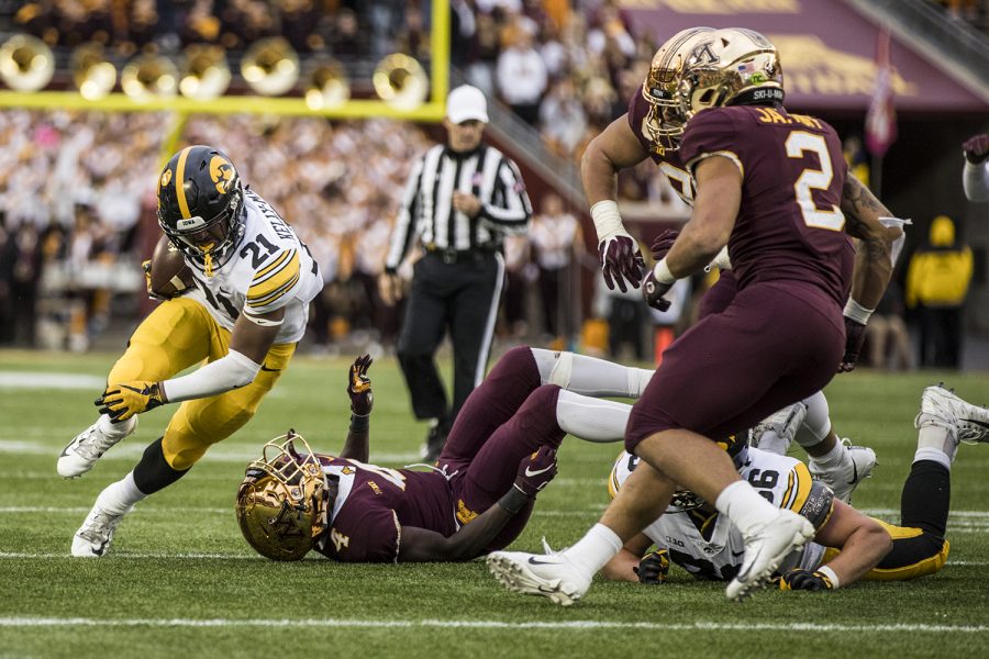 Iowa running back Ivory Kelly-Martin carries the ball during Iowa's game against Minnesota at TCF Bank Stadium on Saturday, October 6, 2018. The Hawkeyes defeated the Golden Gophers 48-31.