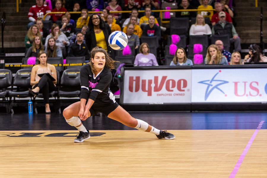 Iowa's Molly Kelly goes for the dig during a volleyball match against Wisconsin on Saturday, Oct. 6, 2018. The Hawkeyes defeated the number six ranked Badgers 3-2. 