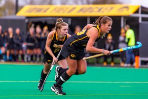 Iowa midfielder Nikki Freeman and Iowa midfielder Sophie Sunderland sprint off their line during a penally corner during a field hockey match against Penn State on Friday, Oct. 12, 2018. The No. 8 ranked Hawkeyes defeated the No. 6 ranked Nittany Lions 3-2. 