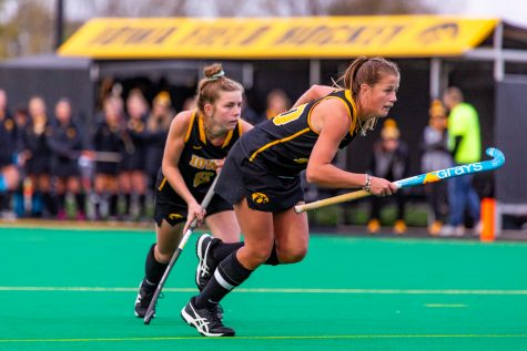 Iowa midfielder Nikki Freeman and Iowa midfielder Sophie Sunderland sprint off their line during a penally corner during a field hockey match against Penn State on Friday, Oct. 12, 2018. The No. 8 ranked Hawkeyes defeated the No. 6 ranked Nittany Lions 3-2. 