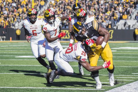 Iowa running back Mekhi Sargent gets tackled on the sideline during a football game between Iowa and Maryland in Kinnick Stadium on Saturday, Oct. 20, 2018. The Hawkeyes defeated the Terrapins, 23-0. 