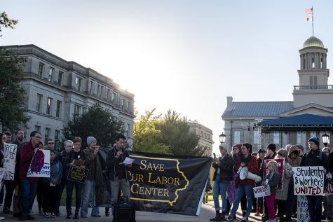 Community members gather on the Pentacrest to protest the closing of the Labor Center on Wednesday, Oct. 17, 2018.