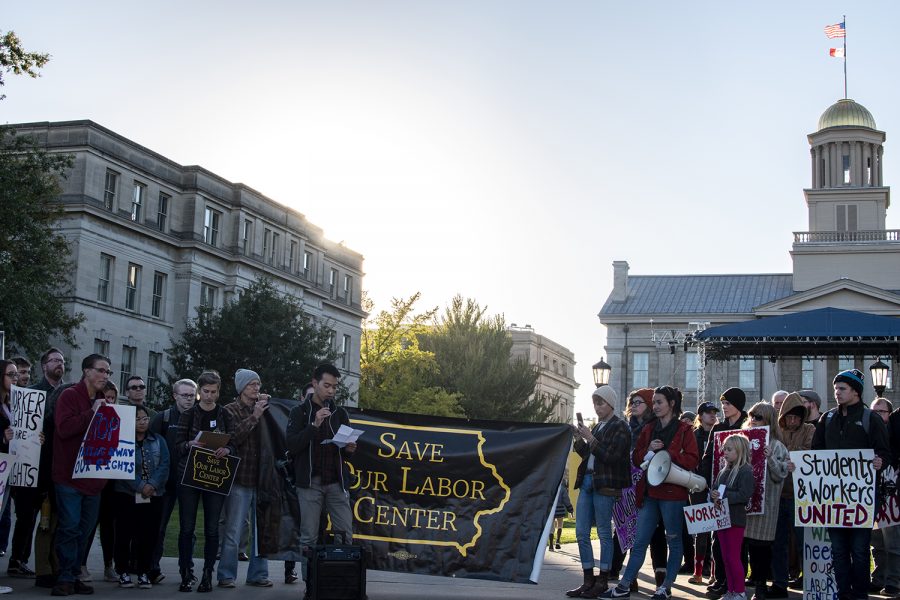 Community members gather on the Pentacrest to protest the closing of the Labor Center on Wednesday, Oct. 17, 2018.