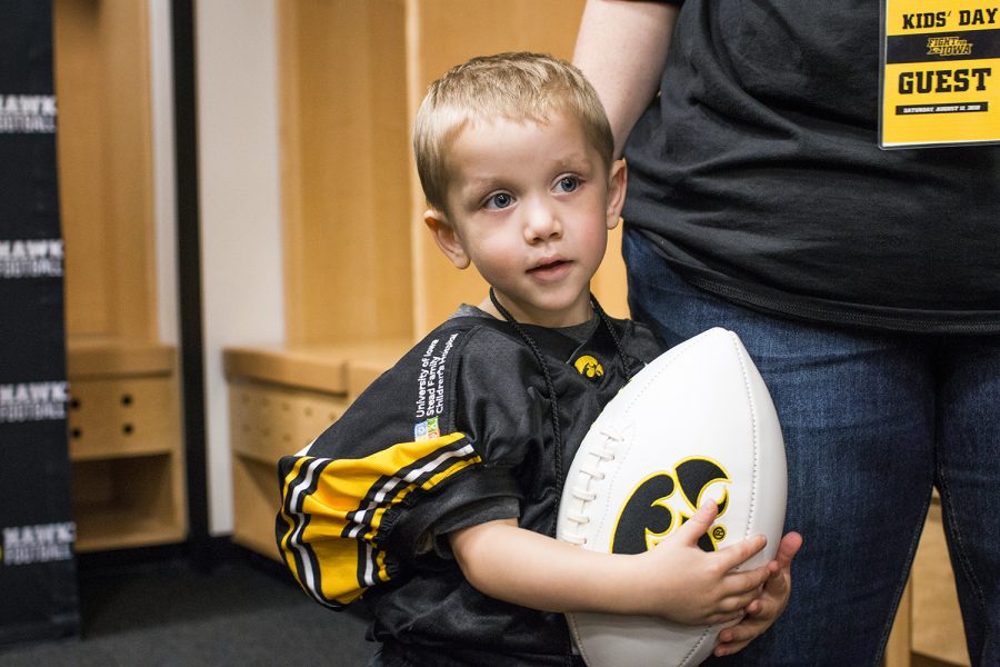 Kid Captain Mason Zabel holds a football during Iowa Football Kids Day at Kinnick Stadium on Saturday, August 11, 2018. The 2018 Kid Captains met the Iowa football team and participated in a behind-the-scenes tour of Kinnick Stadium. Each childs story will be featured throughout the 2018 Iowa football season. 