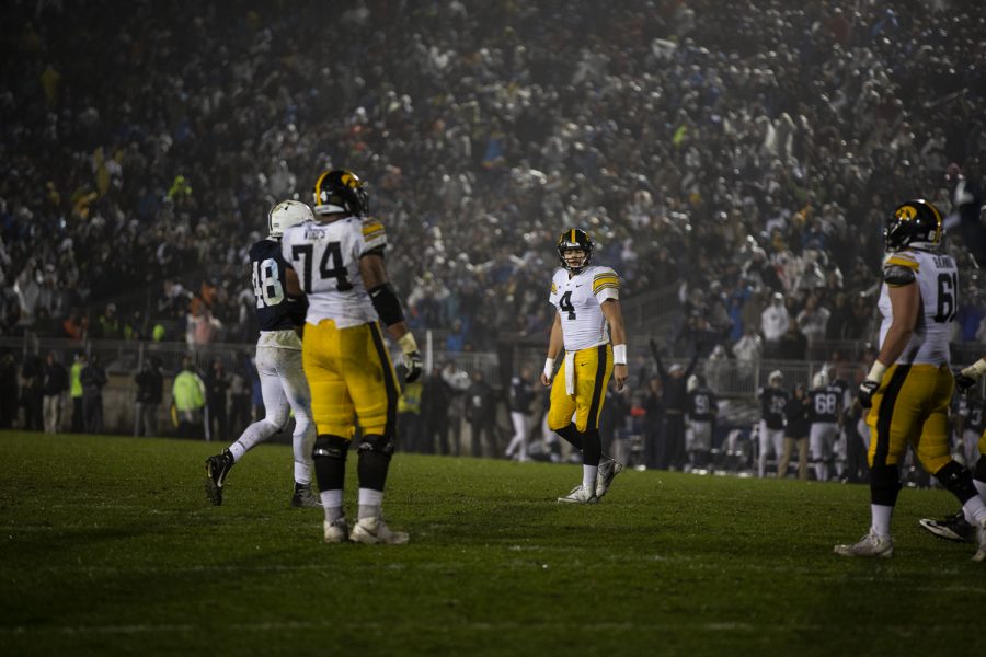 Iowa+quarterback+Nate+Stanley+%284%29+walks+off+the+field+after+throwing+an+interception+during+Iowas+game+against+Penn+State+at+Beaver+Stadium+on+Saturday%2C+October+27%2C+2018.+The+Nittany+Lions+defeated+the+Hawkeyes+30-24.