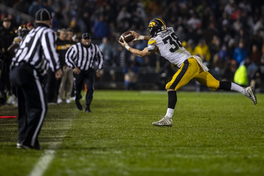 Iowa tight end T.J. Hockenson attempts to make a catch during Iowa's game against Penn State at Beaver Stadium on Saturday, October 27, 2018. Initially ruled a catch on the field, the play was overturned on a replay review. The Nittany Lions defeated the Hawkeyes 30-24.