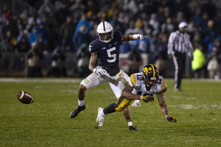 Iowa wide receiver Brandon Smith misses an attempted diving catch during Iowa's game against Penn State at Beaver Stadium on Saturday, October 27, 2018. The Nittany Lions defeated the Hawkeyes 30-24.