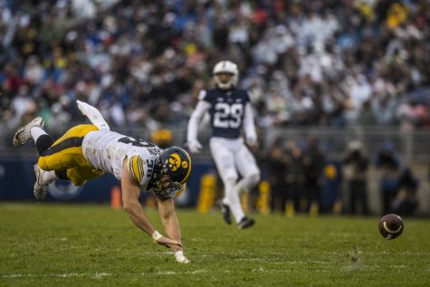 Iowa tight end T.J. Hockenson trips trying to catch up to an overthrown pass during Iowas game against Penn State at Beaver Stadium on Saturday, Oct. 27, 2018. The Nittany Lions defeated the Hawkeyes 30-24.
