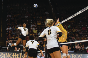 Taylor Louis spikes the ball during Iowas match against Michigan at Carver-Hawkeye Arena on September 23, 2018. The Hawkeyes were defeated 3-1. 