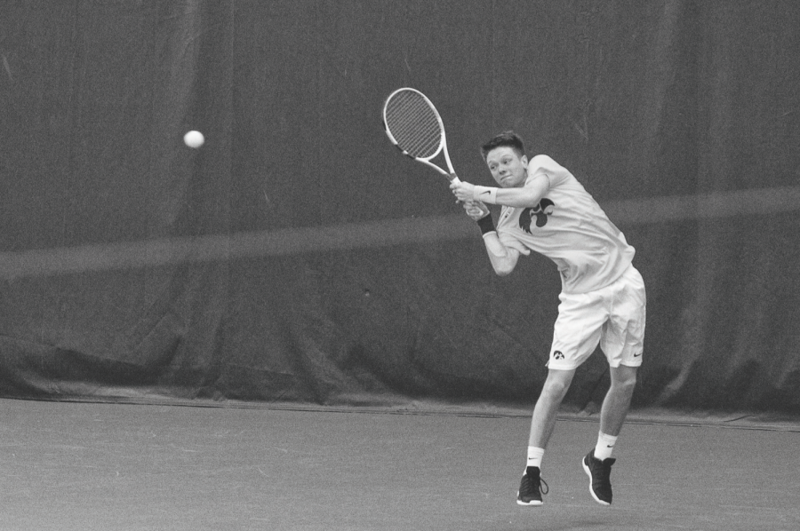 Iowa’s Jason Kerst returns the ball against Creighton at the Hawkeye Tennis & Recreation Complex on Feb. 16. The Hawkeyes defeated the Bluejays, 7-0.
