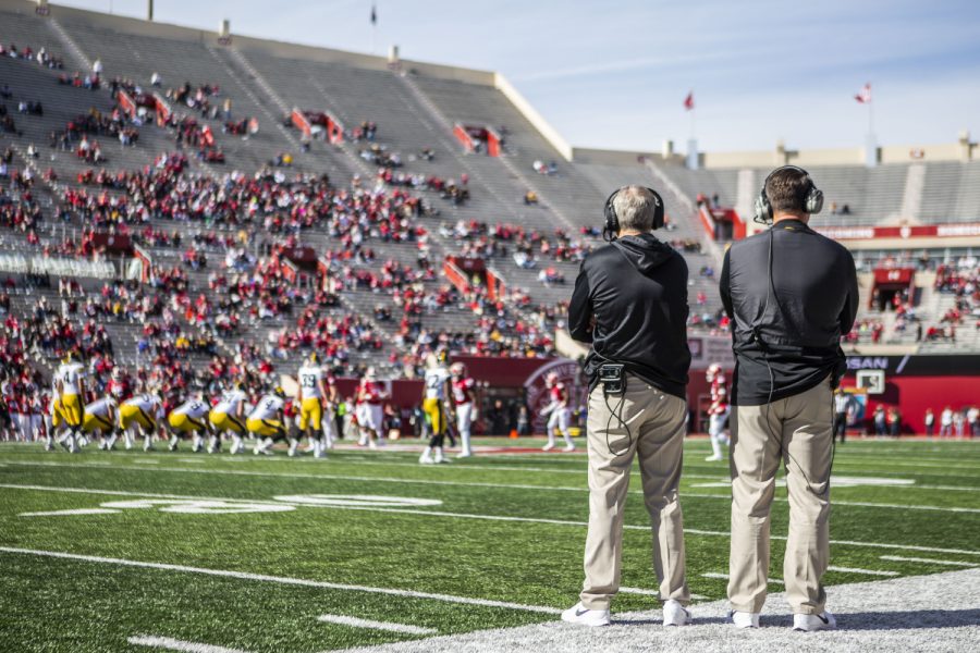 Iowa head coach Kirk Ferentz and offensive coordinator Brian Ferentz watch the game during Iowa's game at Indiana at Memorial Stadium in Bloomington on Saturday, October 13, 2018. The Hawkeyes beat the Hoosiers 42-16. 